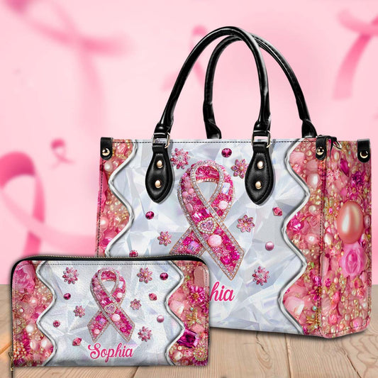 Handbag and wallet set with pink ribbon design on a pink background